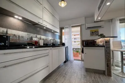 a living room with a couch and a coffee table at Appartement une chambre - Cannes Suquet in Cannes