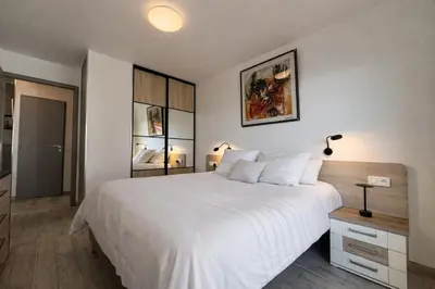 a living room with a couch and a table at Appartement une chambre - Cannes Suquet in Cannes