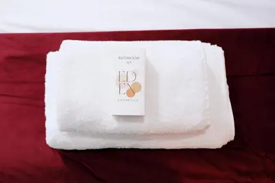 a white towel with the letter b on it at Au coeur du vieux Cannes - 2 pièces - 4 couchages - 500 m du Palais des Festivals in Cannes