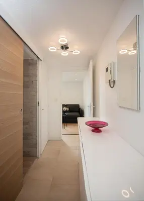 a kitchen with a white counter with a bowl on it at Sunny Duplex by Connexion in Cannes