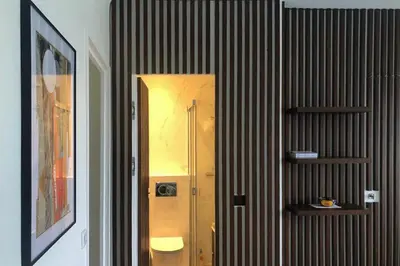 a bathroom with a toilet and a mirror at Sea view apartment-3 pers-with pool-Cannes in Cannes