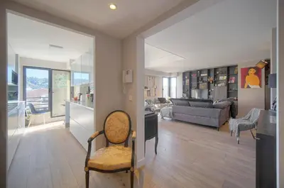 a living room with a chair and a couch at FRGK Air-Conditioned Duplex with Terrace Secure Residence & Premium Amenities in Cannes