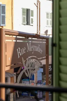 a sign for arue mezcal market on a building at Charmant 2 pièces cœur du Suquet Proche Palais in Cannes