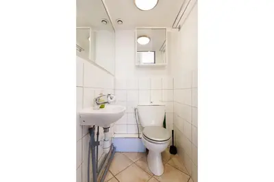 a bathroom with a toilet and a sink at Mouette YourHostHelper in Cannes