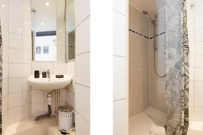 a bathroom with a sink and a shower at Mouette YourHostHelper in Cannes