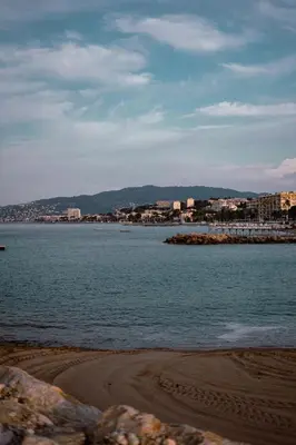 a large body of water with buildings in the background at Hyper centre spacieux & lumineux proche Palais in Cannes