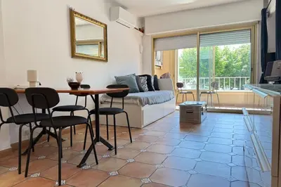 a kitchen with a washing machine and a sink at One-bedroom apt ideally located in front of the Midi beaches in Cannes