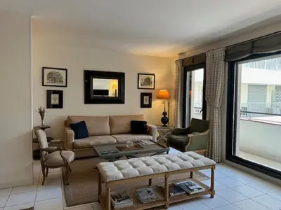 a living room with a couch and a table at Congress et Comfort in Cannes