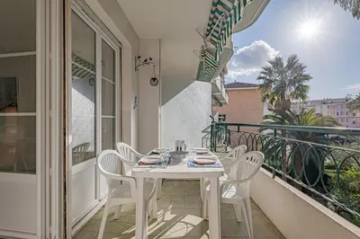 a white table and chairs on a balcony at Le Bleu Ciel - Studio Croisette idéal congrès in Cannes