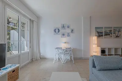 a living room with a couch and a table at Le Bleu Ciel - Studio Croisette idéal congrès in Cannes