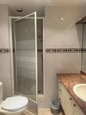 a bathroom with a shower and a toilet and a sink at Premium central Apartment in Cannes