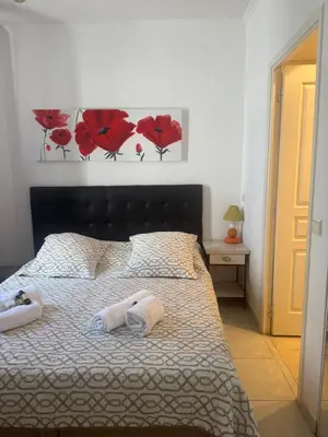 a bedroom with a bed with two towels on it at Premium central Apartment in Cannes