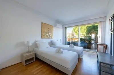 a living room with a white couch and a large window at 104 sqm Sea-View Apartment Cannes in Cannes