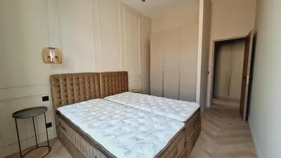 a small bedroom with a bed in a room at first louis marie Beautiful 3 bedrooms elegant and central in Cannes