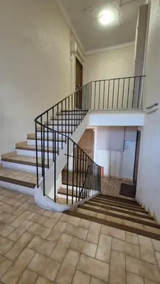 an empty room with stairs in a building at Charming one-bedroom flat on rue Hoche in Cannes