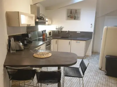 a kitchen with a table and some chairs in it at Villa Cannes in Cannes