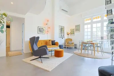 a living room with a couch and a table at 221 Le Bella in Cannes
