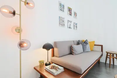 a living room with a couch and a table at 221 Le Bella in Cannes