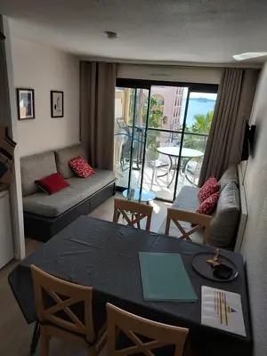 a bedroom with a bed with a wall at Cap ô sud 2 in Cannes