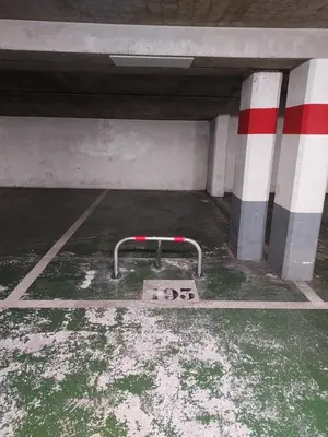 an empty parking lot with a sign in a parking garage at Cap ô sud 2 in Cannes