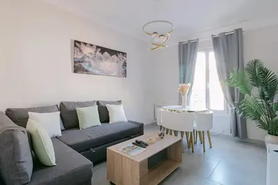 a living room with a couch and a table at Le Corail, Suquet pedestrian area, Cannes in Cannes