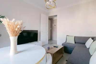 a living room with a couch and a vase on a table at Le Corail, Suquet pedestrian area, Cannes in Cannes