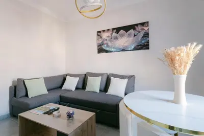 a living room with a couch and a table at Le Corail, Suquet pedestrian area, Cannes in Cannes