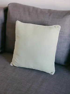 a white pillow sitting on top of a couch at Le Corail, Suquet pedestrian area, Cannes in Cannes