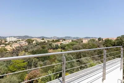 a view of the city from the balcony of a house at Luxury Two-Storey Villa with Pool & Rooftop Peaceful Setting Near Cannes in Cannes