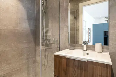 a bathroom with a sink and a shower at Modern Apartment a c 2CH 4P - Cannes in Cannes