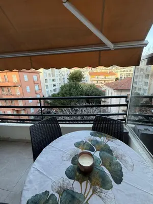 a table with a bowl on top of a balcony at Art apart studio Rouaze in Cannes