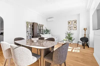a dining room with a table and chairs at Riviera signature apartment by Welcome to Cannes in Cannes