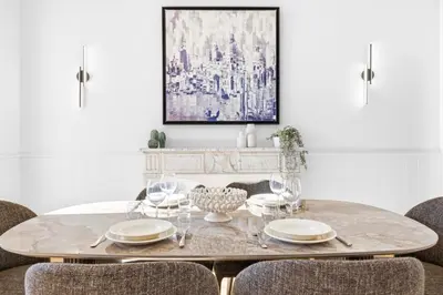 a dining room with a table and chairs at Riviera signature apartment by Welcome to Cannes in Cannes