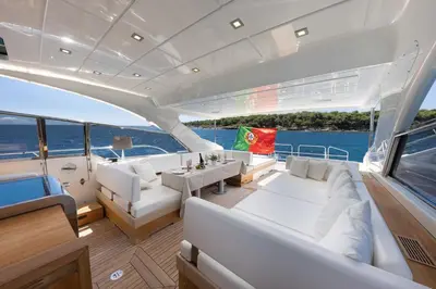 a bedroom with a large bed and a mirror at Yacht Mangusta in Cannes