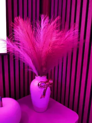a purple bathtub with two chairs and lights in it at California Romantic Suite with Balneo in Cannes