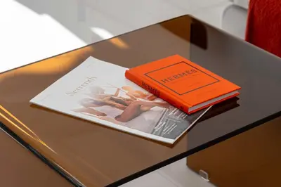 two books sitting on top of a table at 2-Br Sea-View Apartment Residence with Swimming Pool Cannes in Cannes
