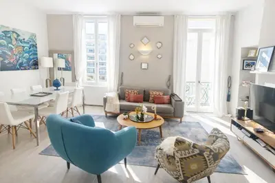 a living room with a couch and a table at Cozystay 1825 Luxury Duplex on Rue dAntibes in Cannes