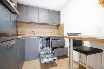 a kitchen with a dish washer in the dishwasher at Sud Croisette - Proche Palais des Festivals in Cannes