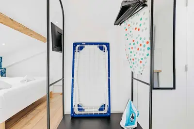a room with a blue and white sled in a bedroom at Suite Azur - Appartement en plein centre de Cannes - Climatisation - Wifi - Proche du Palais des Festivals et des Commerces in Cannes