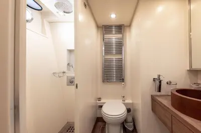 a small bathroom with a toilet and a sink at Votre Palace Flottant sur la Croisette à Cannes in Cannes