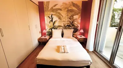 a room with two beds with towels on them at Pointe Croisette, 2 chambres - Exclusivité Congrès - Palmazur Vacances in Cannes