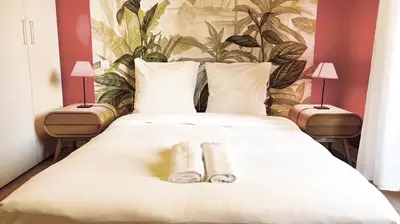 a bed with two rolled up towels on it at Pointe Croisette, 2 chambres - Exclusivité Congrès - Palmazur Vacances in Cannes