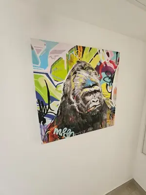 a painting of a gorilla on a wall at 3 pièces lumineux à Cannes in Cannes