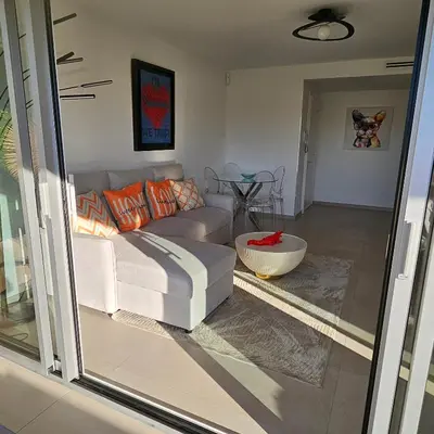 a living room with a couch and a table at 3 pièces lumineux à Cannes in Cannes