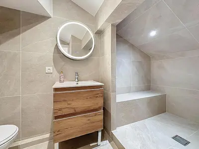 a bathroom with a sink and a toilet and a mirror at 31m2 - appartement en plein centre-ville in Cannes