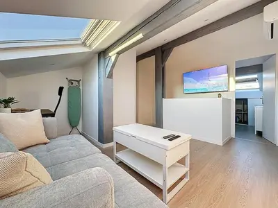 a living room with a couch and a table at 31m2 - appartement en plein centre-ville in Cannes