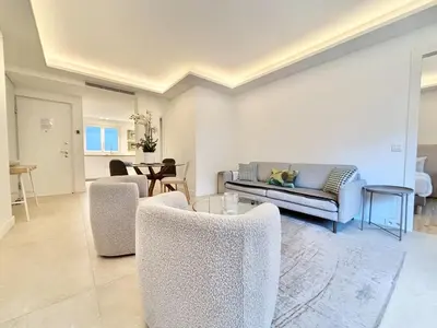 a living room with a couch and a table at Cannes - 2 bedrooms & 2 bathrooms apartment - 24P1 in Cannes