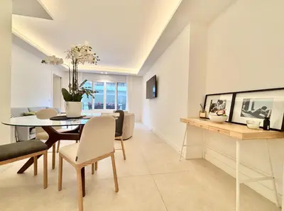 a dining room and living room with a table and chairs at Cannes - 2 bedrooms & 2 bathrooms apartment - 24P1 in Cannes