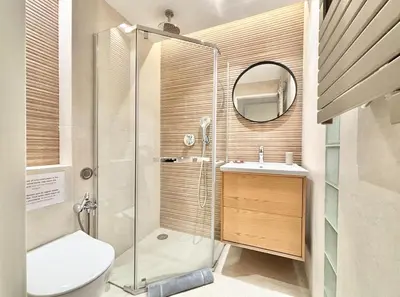 a bathroom with a shower and a toilet and a sink at Cannes - 2 bedrooms & 2 bathrooms apartment - 24P1 in Cannes