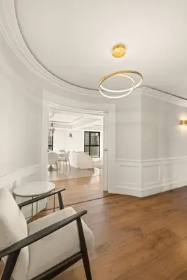 a living room with a table and chairs and a ceiling at Stunning 3BR apartment Carlton Riviera Croisette in Cannes